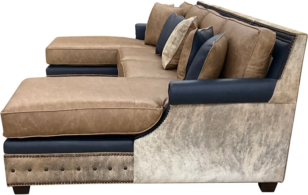 The High Plains Sectional features Palio Camel leather, Palio Grey accent trim, and light exotic cowhide for a modern western luxury statement. Oversized comfort, deep chaise seating, hand applied nailheads, and fully customizable ranch estate craftsmanship.