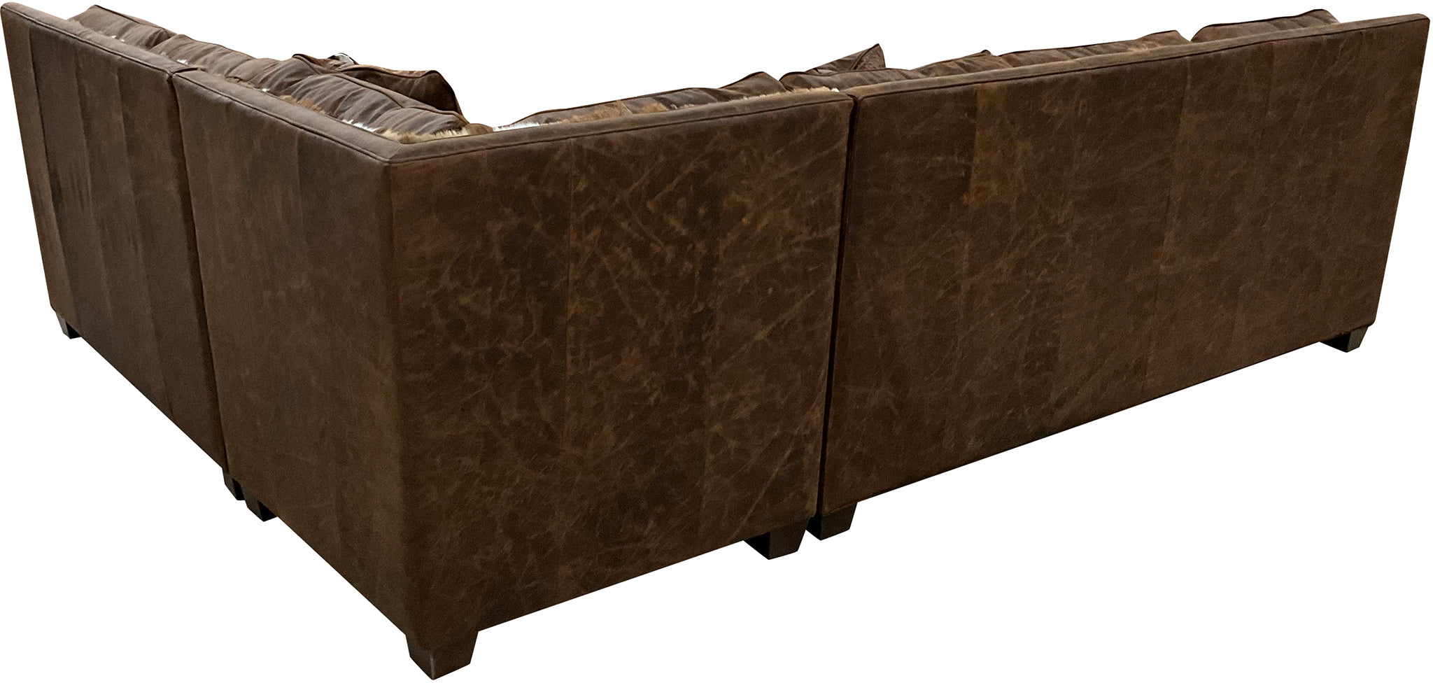 The Springbok Sylvester Sectional Sofa blends Cora Pecan leather, Springbok hides, and Gator Hornback accents in a right arm sofa + square corner + left arm loveseat design. A bold Western statement piece, customizable to fit your home.