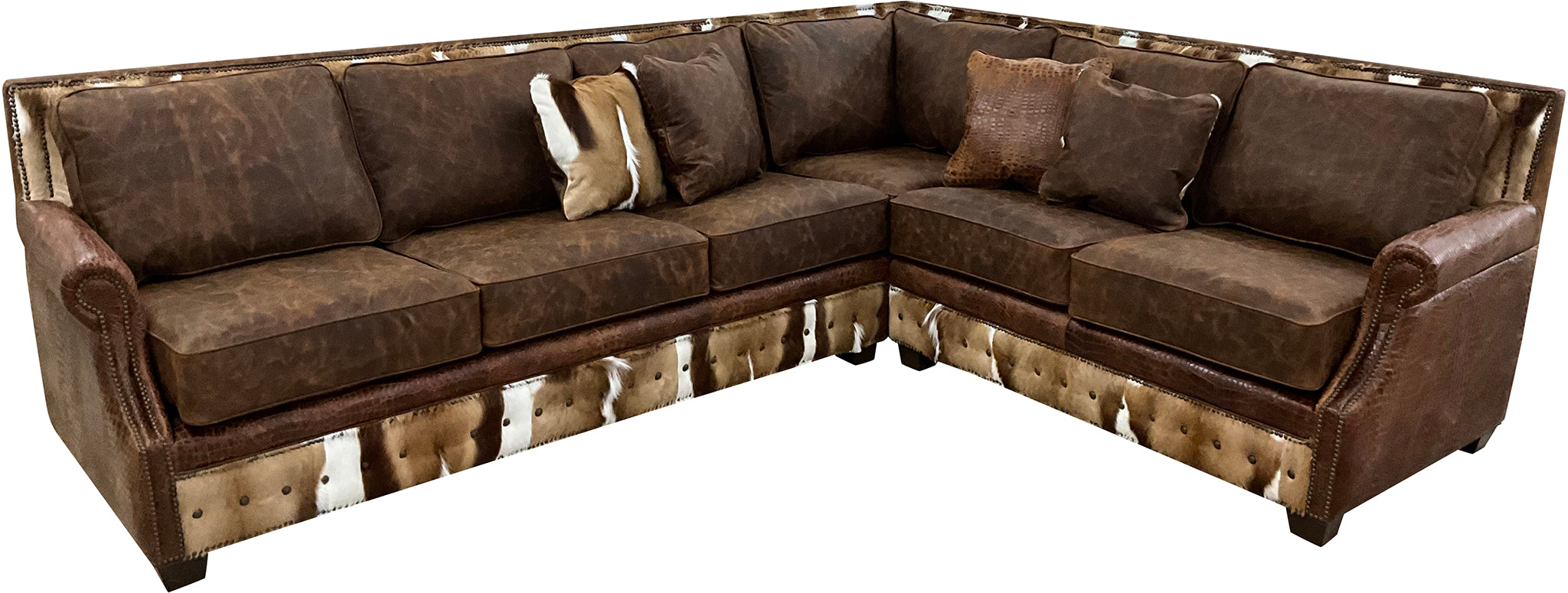 The Springbok Sylvester Sectional Sofa blends Cora Pecan leather, Springbok hides, and Gator Hornback accents in a right arm sofa + square corner + left arm loveseat design. A bold Western statement piece, customizable to fit your home.