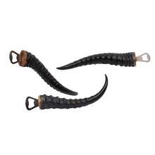 Load image into Gallery viewer, Handcrafted bottle openers made from real warthog tusks and springbok horns. Unique, rustic bar accessories combining natural materials and sturdy metal construction—perfect for collectors and Western-inspired home bars.