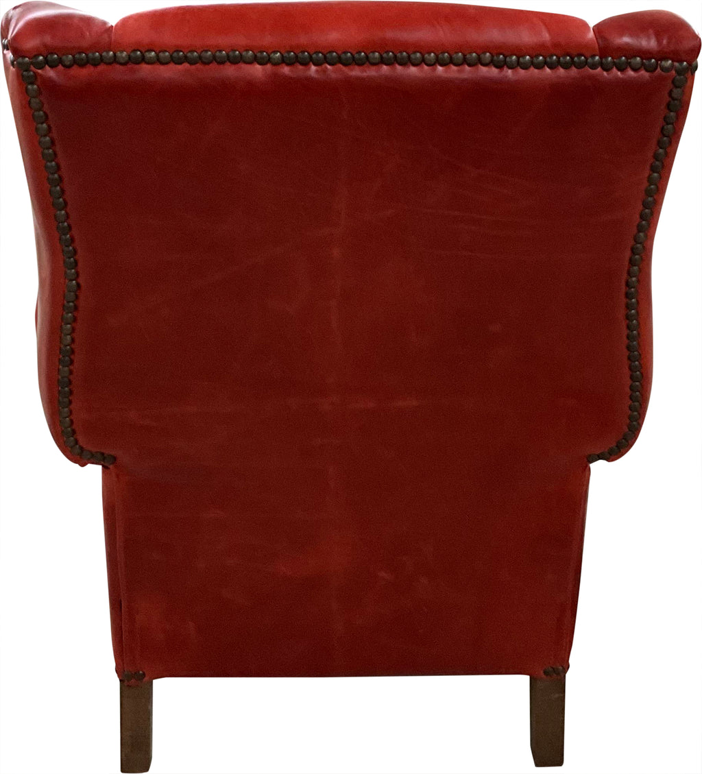 The Paloma Wingback Recliner pairs full-grain crimson leather with handcrafted wood details and a smooth reclining design. A bold expression of Western sophistication — built for beauty, comfort, and lasting craftsmanship.