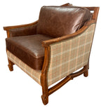 Brown leather and plaid armchair on a white background