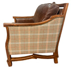 Chair with plaid fabric and wooden frame on a white background