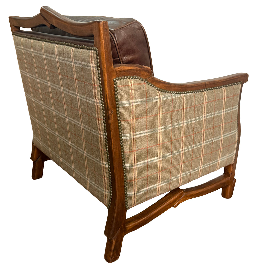 Chair with plaid fabric and wooden frame on a white background