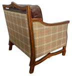 Chair with plaid fabric and wooden frame on a white background