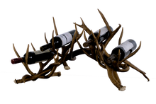 Load image into Gallery viewer, Handcrafted deer antler wine racks for  four bottles. Made from naturally shed antlers, each rack is unique—perfect for rustic, Western, or lodge-style home décor.