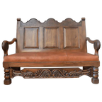Spanish Colonial handcrafted bench with carved panels, leather seat, and ornate details. The La Comarca Bench blends Western elegance with timeless craftsmanship.