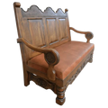 Spanish Colonial handcrafted bench with carved panels, leather seat, and ornate details. The La Comarca Bench blends Western elegance with timeless craftsmanship.