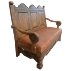 Spanish Colonial handcrafted bench with carved panels, leather seat, and ornate details. The La Comarca Bench blends Western elegance with timeless craftsmanship.