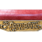 Handcrafted Western bench with longhorn carving, red leather seat, and “Cowboys” inscription. The Cowboy Bench combines rustic artistry with bold, personalized craftsmanship.