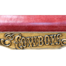 Load image into Gallery viewer, Handcrafted Western bench with longhorn carving, red leather seat, and “Cowboys” inscription. The Cowboy Bench combines rustic artistry with bold, personalized craftsmanship.