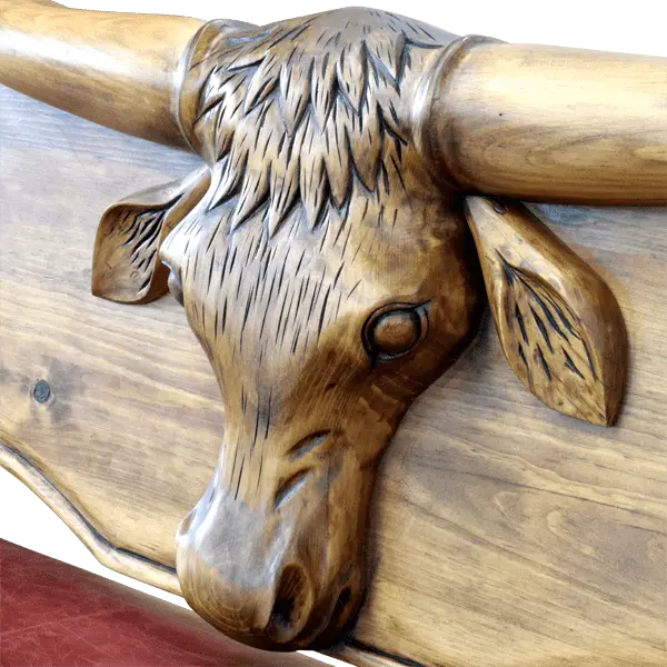 Handcrafted Western bench with longhorn carving, red leather seat, and “Cowboys” inscription. The Cowboy Bench combines rustic artistry with bold, personalized craftsmanship.