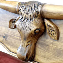 Load image into Gallery viewer, Handcrafted Western bench with longhorn carving, red leather seat, and “Cowboys” inscription. The Cowboy Bench combines rustic artistry with bold, personalized craftsmanship.