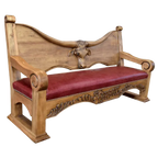 Handcrafted Western bench with longhorn carving, red leather seat, and “Cowboys” inscription. The Cowboy Bench combines rustic artistry with bold, personalized craftsmanship.