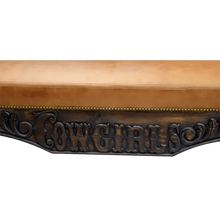 Load image into Gallery viewer, Handcrafted Western bench featuring saddle and lasso carvings, leather seat, and “Cowgirls” inscription. The Cowgirl Bench blends artistry, strength, and frontier elegance.