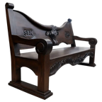 Handcrafted Western bench with longhorn carving, ranch brands, and dark finish. The Cowboy 2 Bench blends rustic strength and refined artistry in a customizable heirloom design.