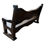 Handcrafted Western bench with longhorn carving, ranch brands, and dark finish. The Cowboy 2 Bench blends rustic strength and refined artistry in a customizable heirloom design.