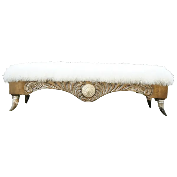 Handcrafted Western bench with Tibetan wool upholstery, silver-finished carvings, and copper conchos. The Santa Petronilla II Bench blends rustic elegance and artisanal craftsmanship in a truly unique design.