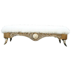 Handcrafted Western bench with Tibetan wool upholstery, silver-finished carvings, and copper conchos. The Santa Petronilla II Bench blends rustic elegance and artisanal craftsmanship in a truly unique design.