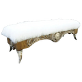 Handcrafted Western bench with Tibetan wool upholstery, silver-finished carvings, and copper conchos. The Santa Petronilla II Bench blends rustic elegance and artisanal craftsmanship in a truly unique design.