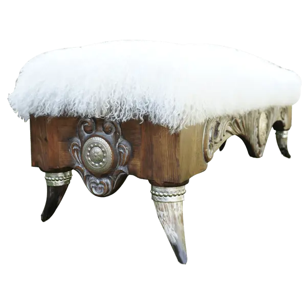 Handcrafted Western bench with Tibetan wool upholstery, silver-finished carvings, and copper conchos. The Santa Petronilla II Bench blends rustic elegance and artisanal craftsmanship in a truly unique design.