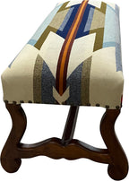 Western Trails Bench by Great Blue Heron Furniture features a hand-carved wood frame and a Pendleton style wool blanket upholstery, blending refined Western luxury with heirloom craftsmanship.