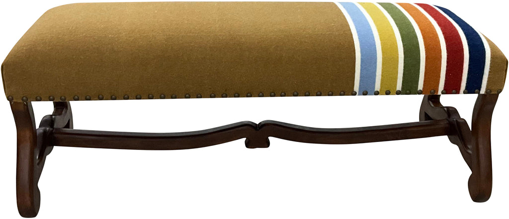 Handcrafted Western bench with a carved wood frame and Pendleton-style striped blanket upholstery. Custom rustic luxury furniture by Great Blue Heron Furniture.