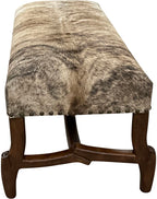 Handcrafted cowhide bench with light exotic hide and hand-carved twig-style wood base. A luxury Western accent bench made in Texas by Great Blue Heron Furniture.