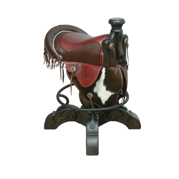 The Bronco Saddle Barstool features a handcrafted full-grain leather saddle seat with cowhide fenders, hand-forged iron medallion, and wood pedestal base. A 180° swivel Western barstool blending authentic cowboy craftsmanship with rustic luxury.