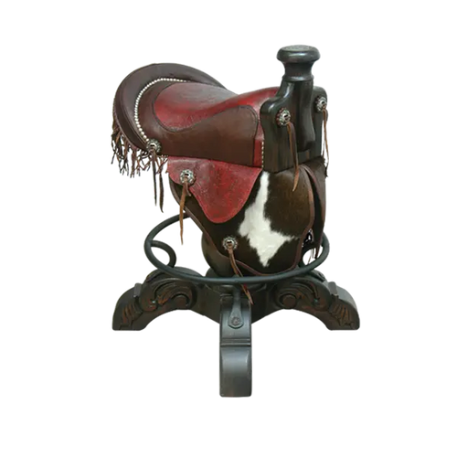 The Bronco Saddle Barstool features a handcrafted full-grain leather saddle seat with cowhide fenders, hand-forged iron medallion, and wood pedestal base. A 180° swivel Western barstool blending authentic cowboy craftsmanship with rustic luxury.