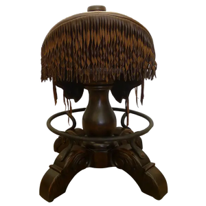 The Bronco Saddle Barstool features a handcrafted full-grain leather saddle seat with cowhide fenders, hand-forged iron medallion, and wood pedestal base. A 180° swivel Western barstool blending authentic cowboy craftsmanship with rustic luxury.