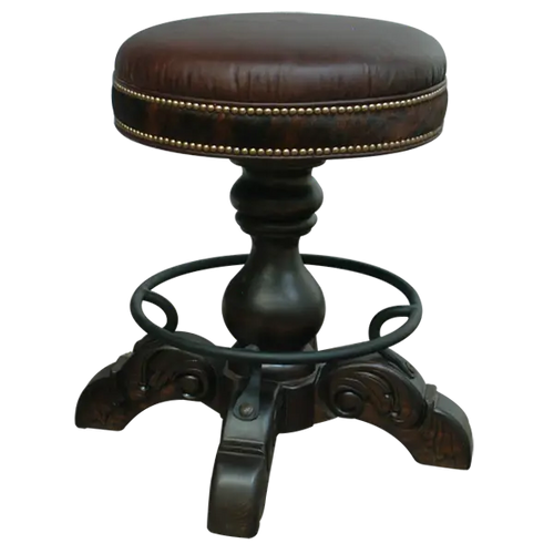 The El Matador Bajo Barstool combines rich leather, hand-tacked cowhide, carved wood, and forged iron for a 360° swivel seat of Western elegance. A handcrafted, fully customizable statement piece built for comfort and timeless style