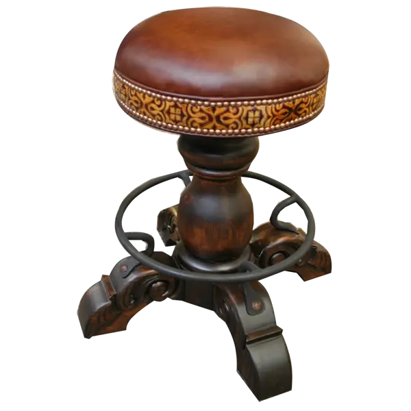 The El Matador Bajo 5 Barstool features brown full-grain leather, hand-tooled accents, and a carved wood base with a forged iron footrest. A 360° swivel and customizable design make it a perfect blend of comfort and craftsmanship.