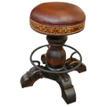 The El Matador Bajo 5 Barstool features brown full-grain leather, hand-tooled accents, and a carved wood base with a forged iron footrest. A 360° swivel and customizable design make it a perfect blend of comfort and craftsmanship.