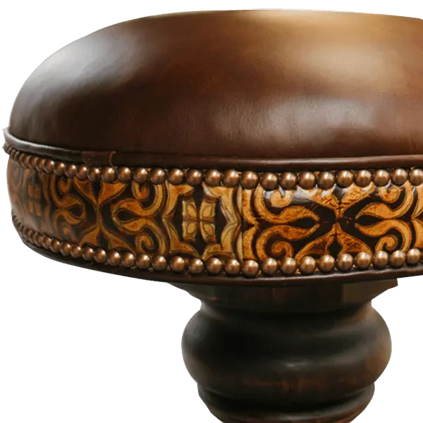 The El Matador Bajo 5 Barstool features brown full-grain leather, hand-tooled accents, and a carved wood base with a forged iron footrest. A 360° swivel and customizable design make it a perfect blend of comfort and craftsmanship.