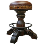 The El Matador Bajo 5 Barstool features brown full-grain leather, hand-tooled accents, and a carved wood base with a forged iron footrest. A 360° swivel and customizable design make it a perfect blend of comfort and craftsmanship.