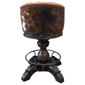 The Rocca La Elegante 2 Barstool features rich brown leather, hand-carved wood, and forged iron details. With a tufted back, 180° swivel, and bold Western style, it’s elegance with rugged sophistication.