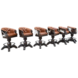 The Rocca La Elegante 2 Barstool features rich brown leather, hand-carved wood, and forged iron details. With a tufted back, 180° swivel, and bold Western style, it’s elegance with rugged sophistication.