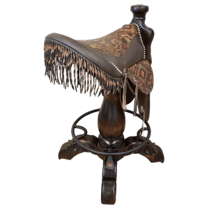 The Chaps Saddle Barstool features full-grain leather, embossed Western patterns, copper conchos, and a 180° swivel wooden base. A handcrafted Western saddle barstool that celebrates cowboy craftsmanship and the artistry of the American frontier.