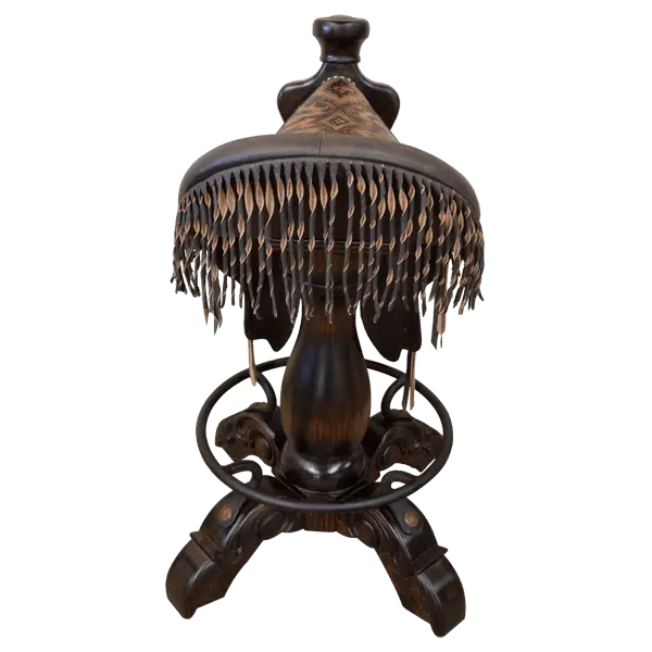 The Chaps Saddle Barstool features full-grain leather, embossed Western patterns, copper conchos, and a 180° swivel wooden base. A handcrafted Western saddle barstool that celebrates cowboy craftsmanship and the artistry of the American frontier.