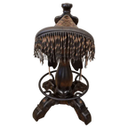 The Chaps Saddle Barstool features full-grain leather, embossed Western patterns, copper conchos, and a 180° swivel wooden base. A handcrafted Western saddle barstool that celebrates cowboy craftsmanship and the artistry of the American frontier.