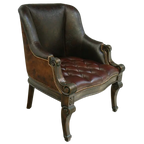 The La Antigua Chair combines full-grain leathers, tufted seating, and hand-carved wood details with a cowhide back. Elegant, durable, and 100% customizable — a striking blend of Western artistry and timeless comfort.