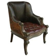 Load image into Gallery viewer, The La Antigua Chair combines full-grain leathers, tufted seating, and hand-carved wood details with a cowhide back. Elegant, durable, and 100% customizable — a striking blend of Western artistry and timeless comfort.