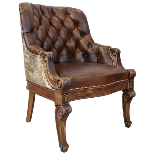 The La Antigua 6 Chair features hand-carved scroll details, tufted full-grain leather, and a sturdy wood frame. Precision hand-tacked upholstery and customizable finishes define this handcrafted Western-style accent chair.