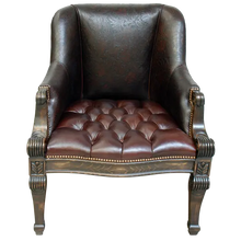 Load image into Gallery viewer, The La Antigua Chair combines full-grain leathers, tufted seating, and hand-carved wood details with a cowhide back. Elegant, durable, and 100% customizable — a striking blend of Western artistry and timeless comfort.