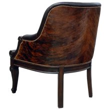 Load image into Gallery viewer, The La Antigua Chair combines full-grain leathers, tufted seating, and hand-carved wood details with a cowhide back. Elegant, durable, and 100% customizable — a striking blend of Western artistry and timeless comfort.