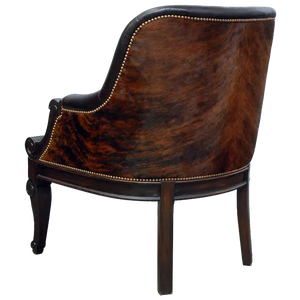 The La Antigua Chair combines full-grain leathers, tufted seating, and hand-carved wood details with a cowhide back. Elegant, durable, and 100% customizable — a striking blend of Western artistry and timeless comfort.