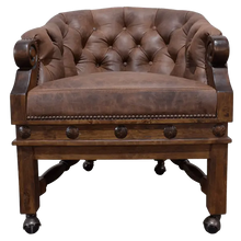 Load image into Gallery viewer, The Elegante Poker 16 Chair combines deep-tufted full-grain leather, hand-carved wood, and rolling casters for luxury and comfort. A timeless handcrafted Western chair, customizable to your taste and built for lasting sophistication.