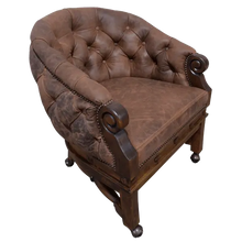 Load image into Gallery viewer, The Elegante Poker 16 Chair combines deep-tufted full-grain leather, hand-carved wood, and rolling casters for luxury and comfort. A timeless handcrafted Western chair, customizable to your taste and built for lasting sophistication.