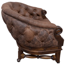 Load image into Gallery viewer, The Elegante Poker 16 Chair combines deep-tufted full-grain leather, hand-carved wood, and rolling casters for luxury and comfort. A timeless handcrafted Western chair, customizable to your taste and built for lasting sophistication.